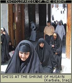 Shi'is coming out of a Shi'i shrine in Karbala, Iraq