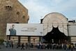 The entrance to the Hamadiya Souk. Guarded by the citadel and the beloved president.
